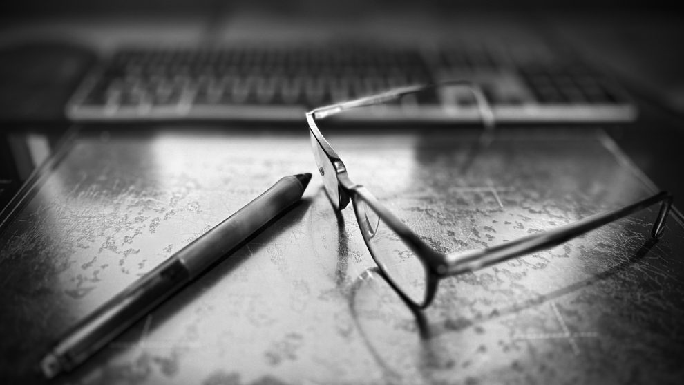 an old Wacom tablet and pair of glasses. Todays tools of the trade